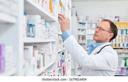 Pharmacist Working In A Drugstore