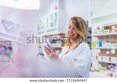 Similar – Image, Stock Photo Female chemist hand holding magnifying glass to analyze golden glitter sample on petri dish in lab