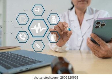 Pharmacists or doctors study information about tablets in the operating room in the evening.