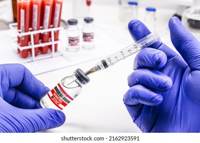 Pharmacist's Hand With Latex Glove Preparing Monkeypox Vaccine, Pharmaceutical Laboratory