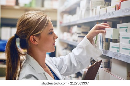 Pharmacists Improve Medication Adherence. Shot Of A Pharmacist Looking At Medication On A Shelf.