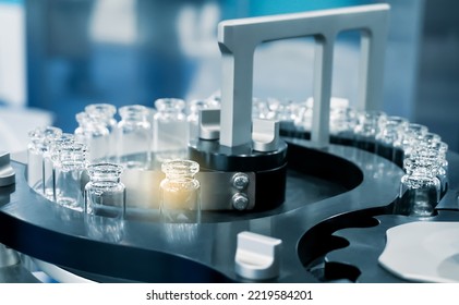 Pharmacological Production. Aseptic Vaccine Vials In The Production Line. Sterile Capsules For Injection Bottles On The Bottling Line Of The Pharmaceutical Plant.                                      