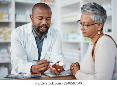 Pharmacy, black man and woman with healthcare medicine and conversation for instructions. Pharmacist, female patient or medical professional talking, stress or explain prescription to senior customer - Shutterstock ID 2248587549