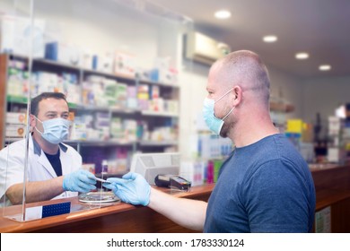 Pharmacy During Covid-19. Shopper In Drugstore. People In Protective Medical Masks Buys Medicine. Pharmacy, Pharmacist. Covid And Retail