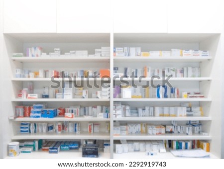 Pharmacy interior background blurred light tone with store drugs shelves. Background of pharmacy. Drug medical shop drugstore medication.