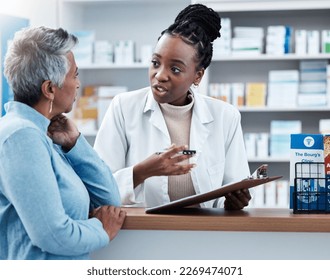 Pharmacy, medical or insurance with a customer and black woman pharmacist in a dispensary. Healthcare, clipboard and trust with a female medicine professional helping a patient in a drugstore - Powered by Shutterstock