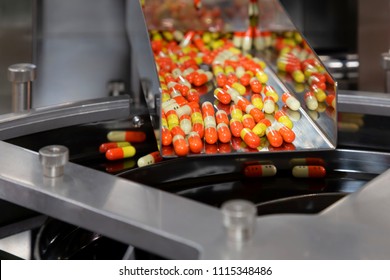 Pharmacy Medicine Capsule Pill In Production Line At Medical Factory. Selective Focus.