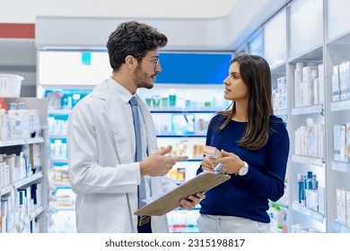 Pharmacy, medicine and pharmacist talking to customer while working in a retail store. Professional man in pharmaceutical or medical industry for service, healthcare and advice for a woman client - Powered by Shutterstock