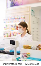 Pharmacy, Pharmacist Reads A Prescription, Cash Register In A Pharmacy, In A Medical Mask