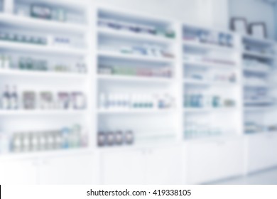 pharmacy shelves filled with medication blur background