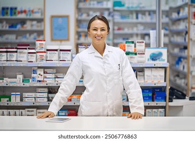 Pharmacy, smile and portrait of woman at counter in drugstore for customer service, advice and medicine. Prescription drugs, pharmacist and inventory with pills, medication and checkout at chemist - Powered by Shutterstock