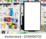 Pharmacy store. Blank empty white display panel advertising sign against blurred shelves in medical shop. Drugstore sales pills, vaccines and health care products.