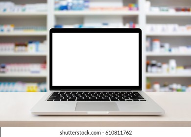 Pharmacy Store With Laptop Computer On Medical Counter