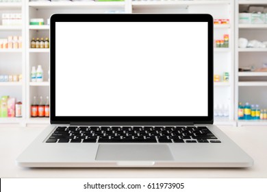 Pharmacy Store With Laptop Computer On Medical Counter