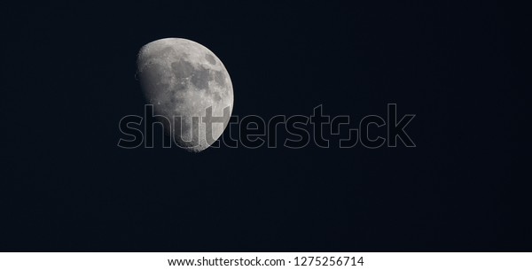 Phase of the moon highly detailed photo of the bright\
moon in the night sky