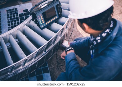 Phased array (PAUT), ultrasound tests to check for imperfections or faults in external steel pipe welding, NDT inspection. - Shutterstock ID 1591202725