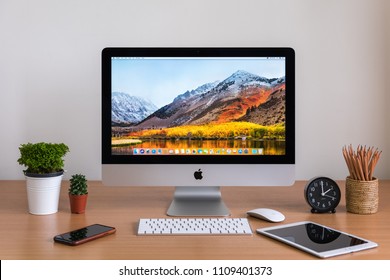 PHATTHALUNG, THAILAND - MARCH 24, 2018: IMac Computers, IPhone, IPad, Keyboard, Magic Mouse, Plant Vase, Cactus, Pencils  And Clock On White Desk, Created By Apple Inc.