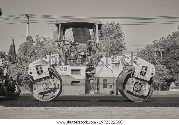 Phayao, Thailand - Jan 27, 2021: Black and White\
Road Roller on The Asphalt\
Road