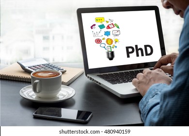 PhD Doctor Of Philosophy Degree Education Graduation Thoughtful Male Person Looking To The Digital Tablet Screen, Laptop Screen,Silhouette And Filter Sun