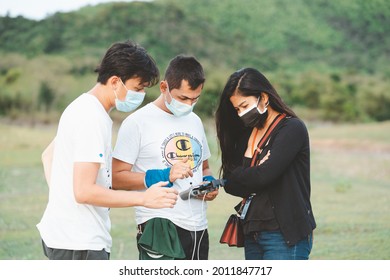 Phetchaburi, Thailand -July 9,2021:Behind The Scene. Film Crew Team Filming Movie Scene On Outdoor Location While Wearing Mask Prevent Covid-19 Or Coronavirus Quarantine Pandemic In Thailand.