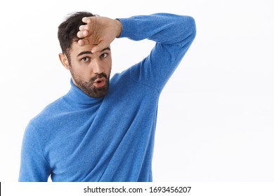 Phew That Was Close. Portrait Of Relieved Handsome Bearded Man Wiping Sweat From Forehead And Exhale As Got Rid Of Problem, Finished Task, Feeling Exhausted, Standing White Background