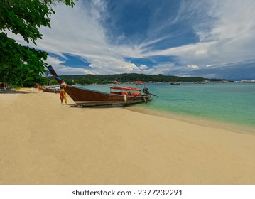 Phi Phi island one of the wonders of beauty just off the coast of phuket thailand. Phi phi island is famous for turquoise clear blue waters teaming with Corel reef fish white soft sand 