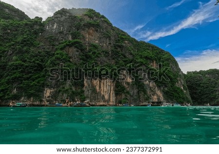 Phi Phi island one of the wonders of beauty just off the coast of phuket thailand. Phi phi island is famous for turquoise clear blue waters teaming with Corel reef fish white soft sand 