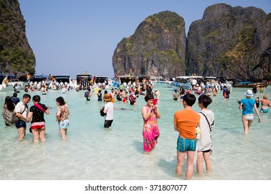 PHI PHI ISLANDS, THAILAND - CIRCA FEBRUARY, 2015: Tourists relax on the beach of Maya Bay on Phi Phi Leh island. It starred the famous movie The Beach with the actor Leonardo DiCaprio