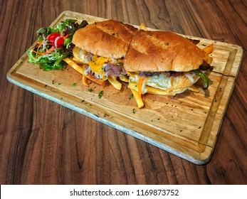 Philadelphia Cheesesteak, Philly Cheesesteak, Cheesesteak Sandwich, Cheese Steak, Or Steak And Cheese, Is A Sandwich Made From Thinly Sliced Pieces Of Beefsteak And Melted Cheese In A Long Hoagie Roll