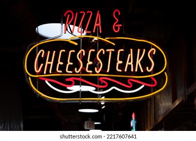 Philadelphia, PA - October 22 2022: Pizza And Cheesesteak Neon Sign In Philadelphia