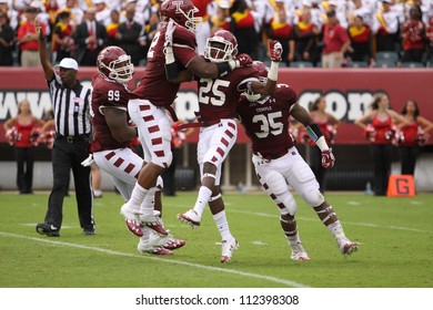 PHILADELPHIA, PA. - SEPTEMBER 8: Temple Defenders Celebrate A Quarterback Sack Late In The Game Against Maryland On September 8, 2012 At Lincoln Financial Field In Philadelphia, PA.