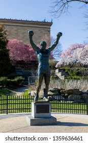 Philadelphia, PA / USA - April 3rd, 2019: Rocky Balboa Statue In Front Of The Philadelphia Art Museum. Statue From Famous Rocky Series Movies In The City Of Brotherly Love. 