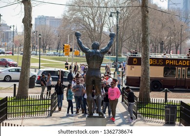 Philadelphia, Pa. USA, April 7, 2019: Rocky statue in Philadelphia with people taking pictures. April 7, 2019 in Philadelphia, Pa. USA