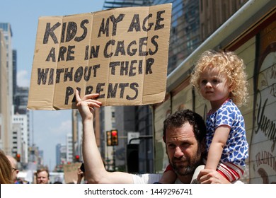 Philadelphia, PA / USA - July 12, 2019: A Father And Child Hold A Protest Sign To Demand The Closure Of Detention Camps At The U.S.-Mexico Border. 