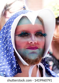 Philadelphia, PA / USA - June 9, 2019: A Trans Man Proudly Wears The Transgender Pride Flag On His Face During The Philly Pride Parade.