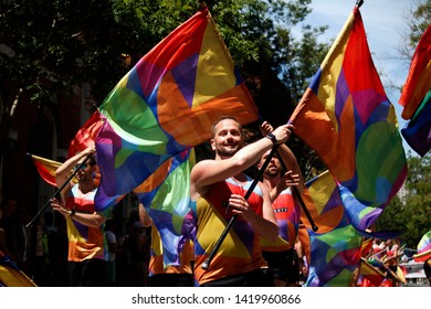 Philadelphia, PA / USA - June 9, 2019: Members Of The Flaggots Color Guard Flag Team Put On A Show During The Philly Pride Parade.