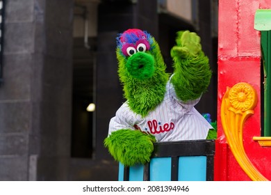 Philadelphia, PA, USA - November 25, 2021: The Phillie Phanatic waves to the crowd at the 102nd annual Thanksgiving Day Parade.