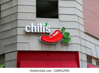 Philadelphia, Pennsylania, USA - 29 April 2022: The Outside Exterior Of A Chili's Restaurant With Their Logo Above The Entrance To A Corner Store In The City Of Philadelphia.