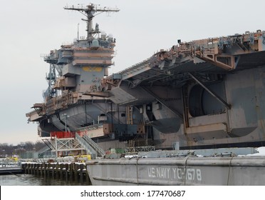 PHILADELPHIA, PENNSYLVANIA - February 16, 2014:   Decommissioned U.S. Navy Aircraft Carrier USS John F. Kennedy In The NAVSEA Inactive Ships On-site Maintenance Facility At The Philadelphia Navy Yard.