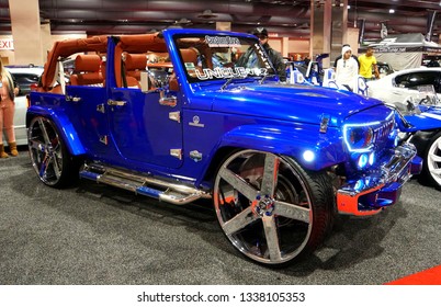 Philadelphia, Pennsylvania, U.S.A - February 10, 2019 - A Fully Modified Blue Jeep Wrangler With No Top And A Large Wheel With Run Flat Tires