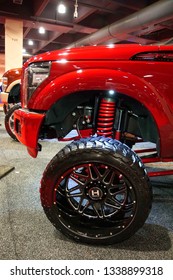 Philadelphia, Pennsylvania, U.S.A - February 10, 2019 - A Red Truck With A Suspension Lift Kit 