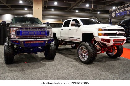 Philadelphia, Pennsylvania, U.S.A - February 10, 2019 - A Chevy And A Ford Truck With A Suspension Lift Kit 