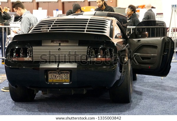 Philadelphia, Pennsylvania,\
U.S.A - February 10, 2019 - An all-black Ford Mustang at\
Philadelphia Car\
Show