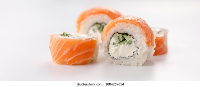 Philadelphia roll sushi on a white plate. Isolated. Restaurant concept.