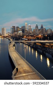 Philadelphia skyline at night with urban architecture.