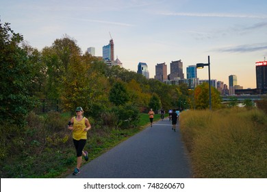 Philadelphia, USA - 2 November 2017. People Running On The Schuylkill River Trail In The Evening