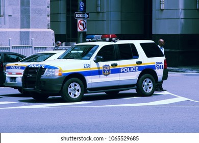 PHILADELPHIA, USA - JUNE 11, 2013: Unidentified Person Walks By Philadelphia Police Ford Explorer. Philadelphia Police Department Is The Oldest City Police Agency In The US (formed 1751).