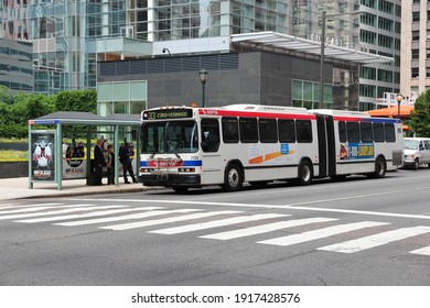 PHILADELPHIA, USA - JUNE 11, 2013: People ride SEPTA articulated bus in Philadelphia. SEPTA served almost 321 million rides in 2010.