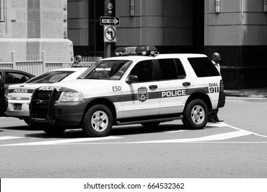 PHILADELPHIA, USA - JUNE 11, 2013: Unidentified Person Walks By Philadelphia Police Ford Explorer. Philadelphia Police Department Is The Oldest City Police Agency In The US (formed 1751).