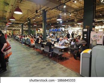 Philadelphia, USA - June 11, 2019: People Hanging Around, Drinking And Eating In The Reading Terminal Market In Philadelphia.